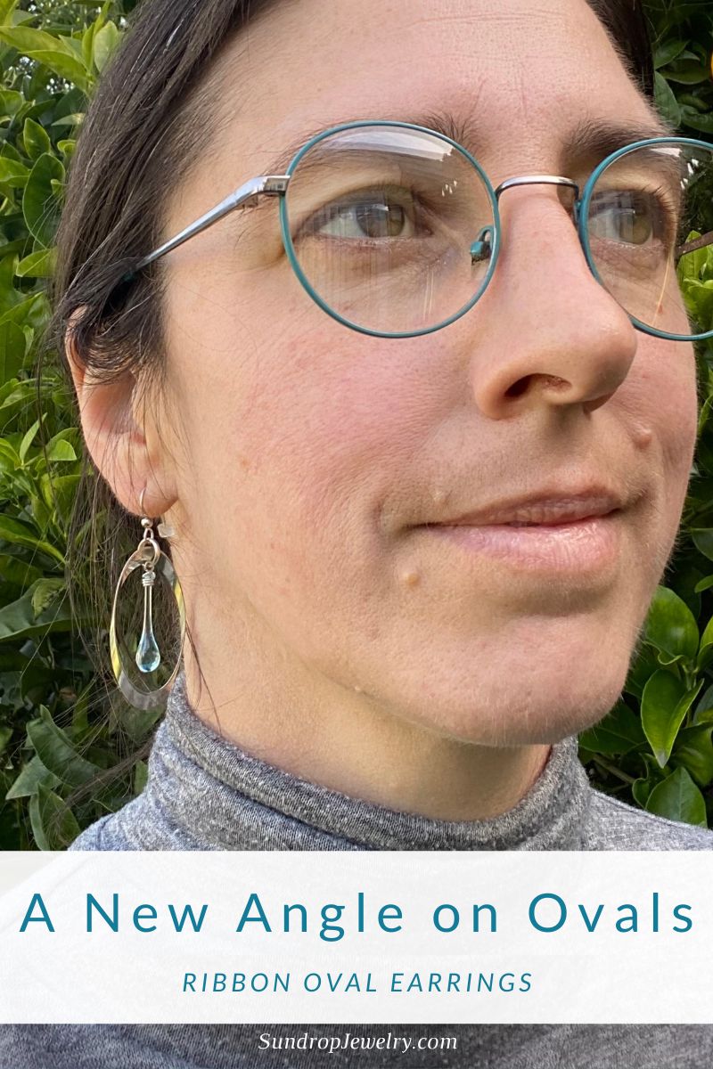 A new angle on ovals - an angled silver oval frames a dew-colored teardrop of sun-melted glass, by Sundrop Jewelry